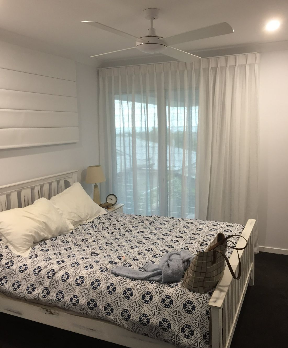 White Pleat Curtains In A Bedroom — Studio Curtains & Blinds in Mount Gravatt, QLD
