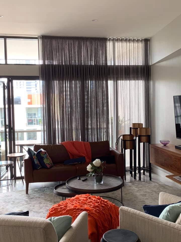 Brown & Orange Living Room With Sheer Curtains — Studio Curtains & Blinds in Mount Gravatt, QLD