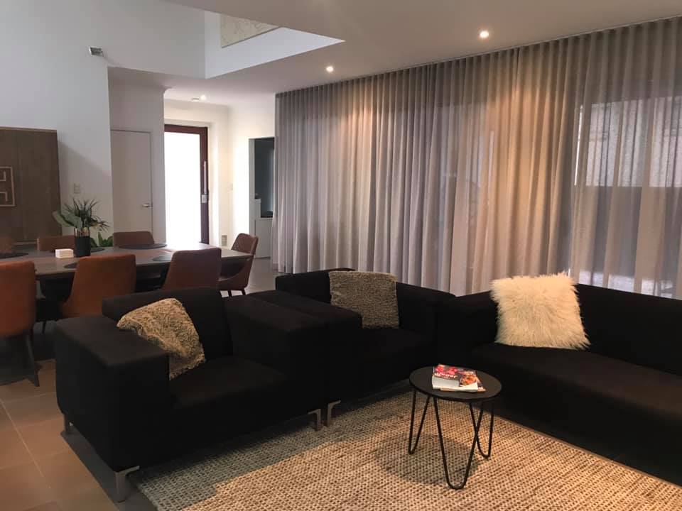 Living Room With S-fold Curtains — Studio Curtains & Blinds in Mount Gravatt, QLD