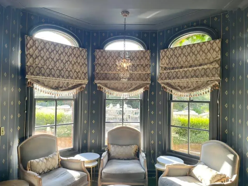 A Living Room With Chairs, Tables and a Chandelier — Studio Curtains & Blinds in Mount Gravatt, QLD