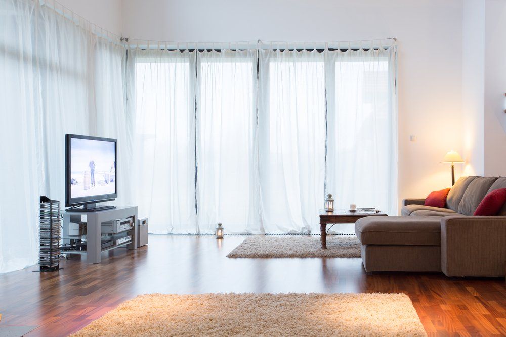 Living Room With Big Windows & Curtains — Studio Curtains & Blinds in Mount Gravatt, QLD