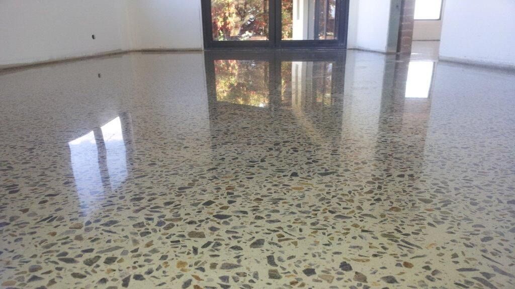 Empty Polished Lobby Floor Reflecting Windows and a Doorway in a Bright Interior — Unique Floors In New Town, TAS