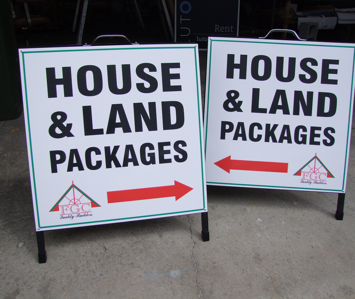 A couple of signs that say house and land packages