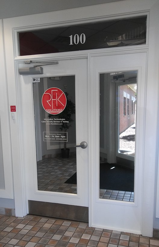 A white door with a glass window and the number 100 on it.