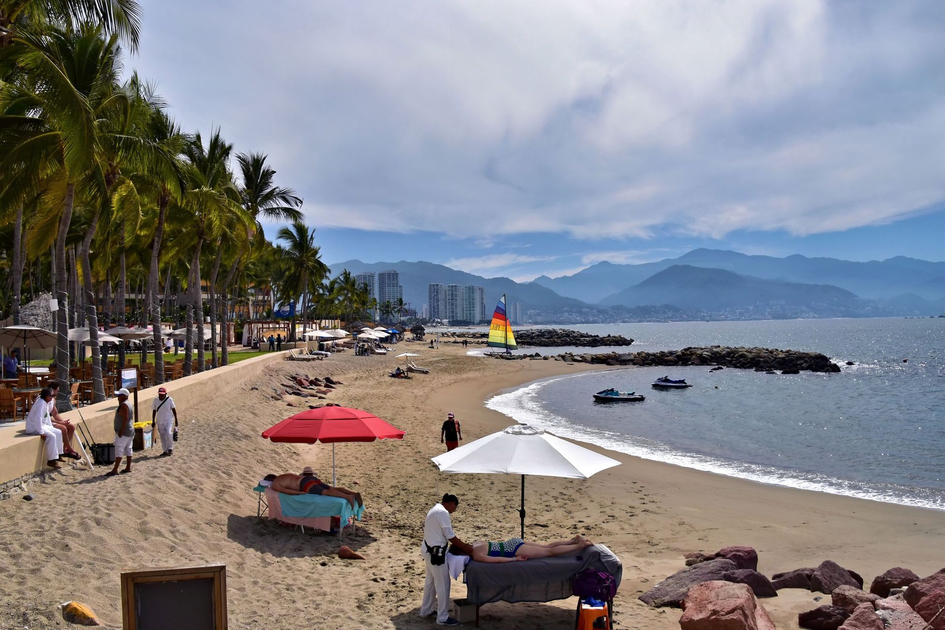 Tourists and locals walking safely through the streets of Puerto Vallarta Mexico at night during a food tour