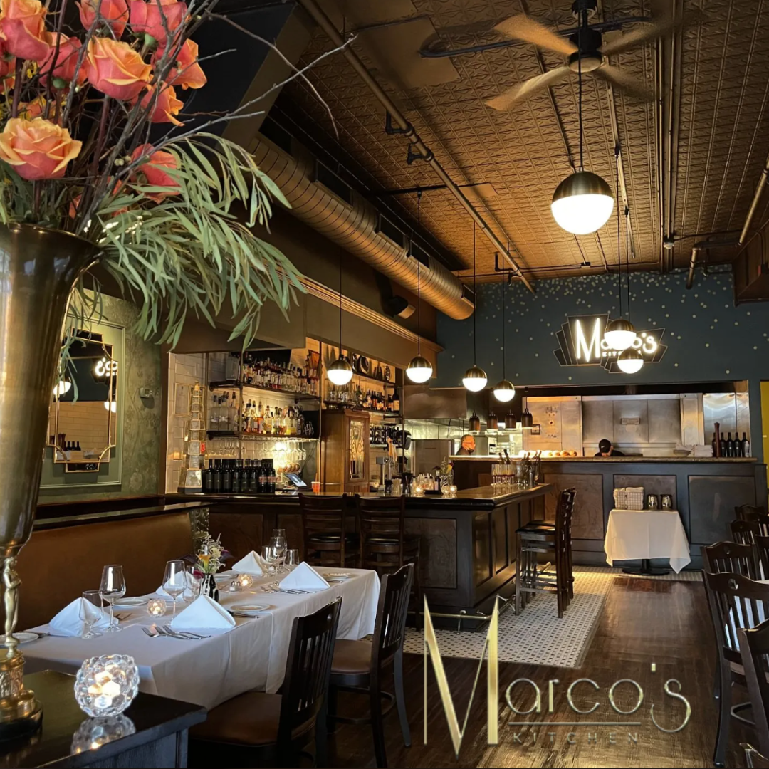 A restaurant called marco 's with tables and chairs