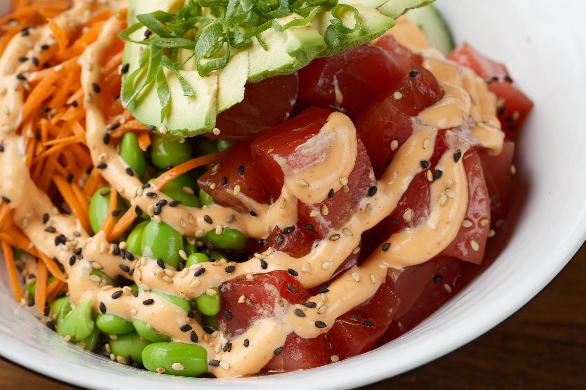 A close up of a bowl of food on a table.
