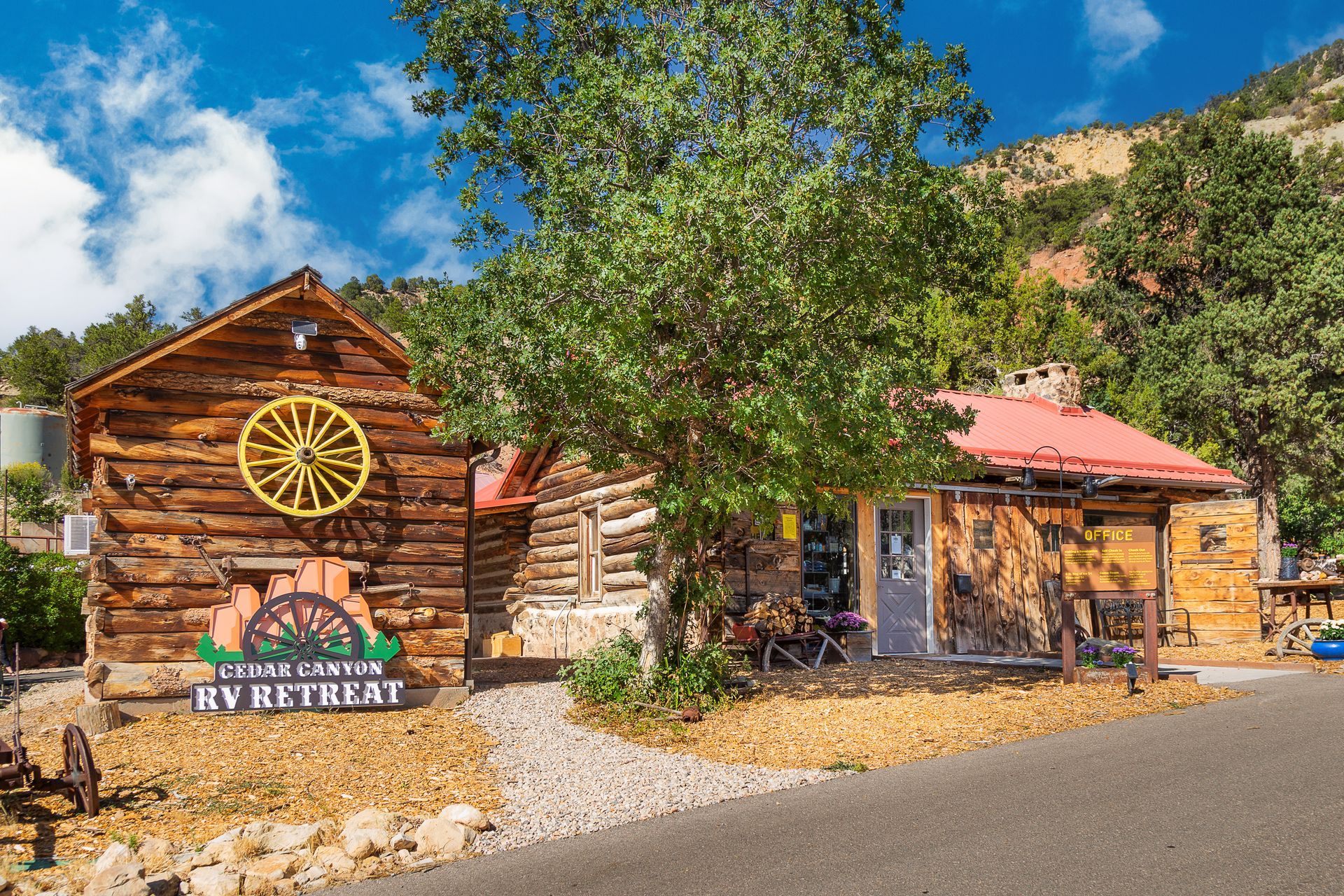A log cabin with a sign that says rv retreat on it.