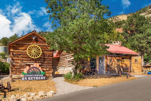 A log cabin with a sign that says rv retreat on it.