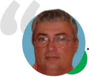A man wearing glasses is in a circle with a quote behind him