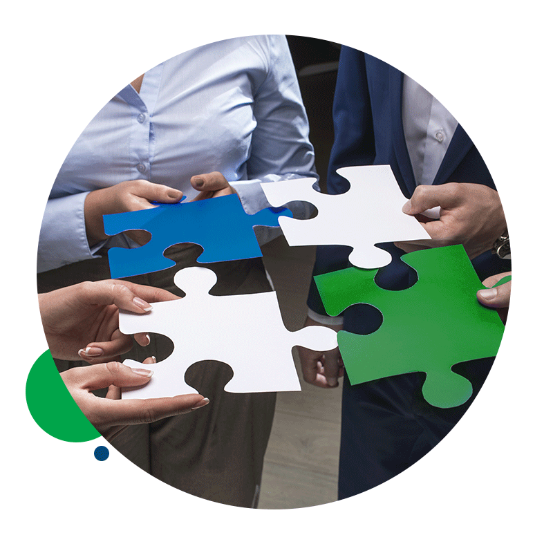 A group of people are holding puzzle pieces in their hands.