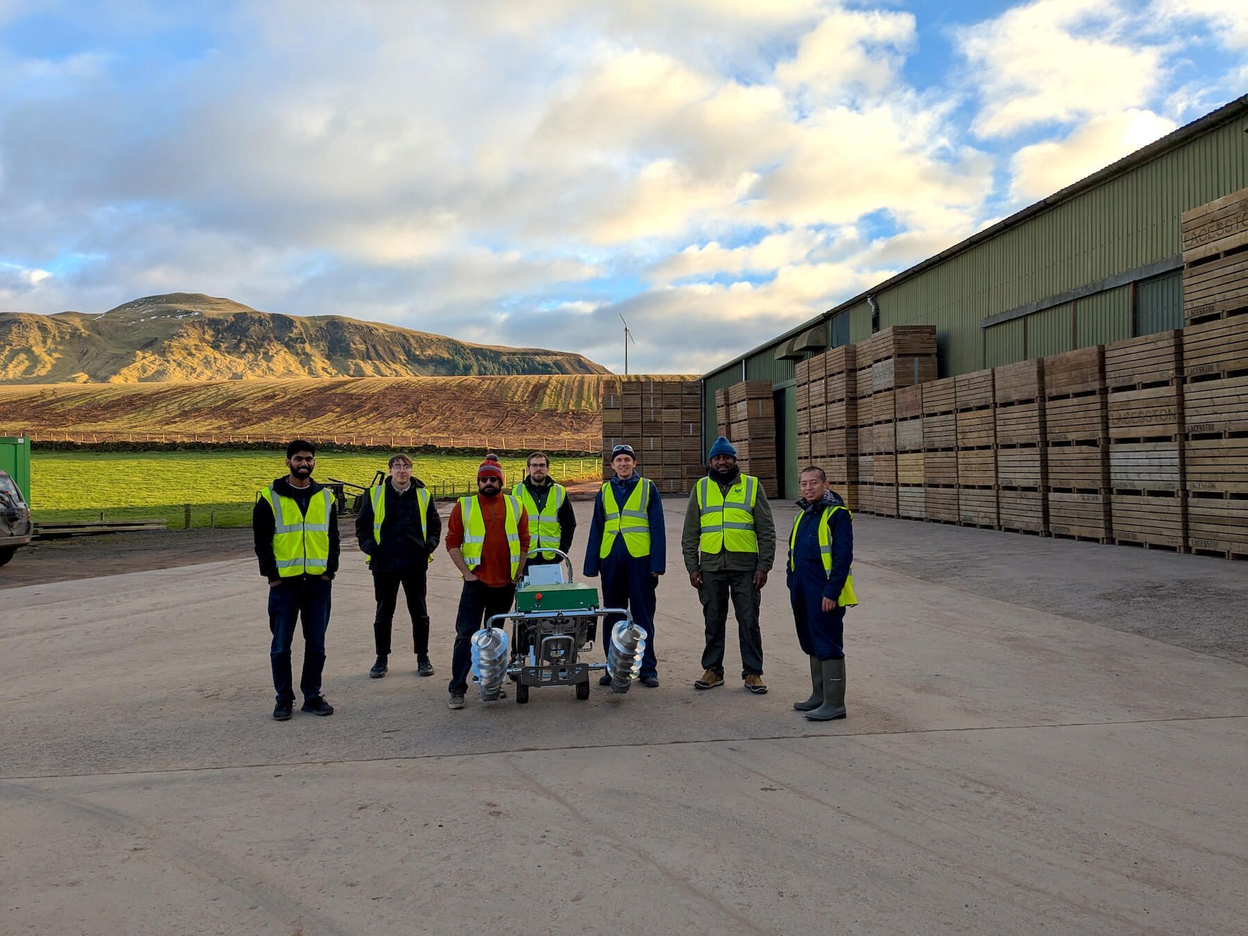 Crover team with system outside grain storage shed