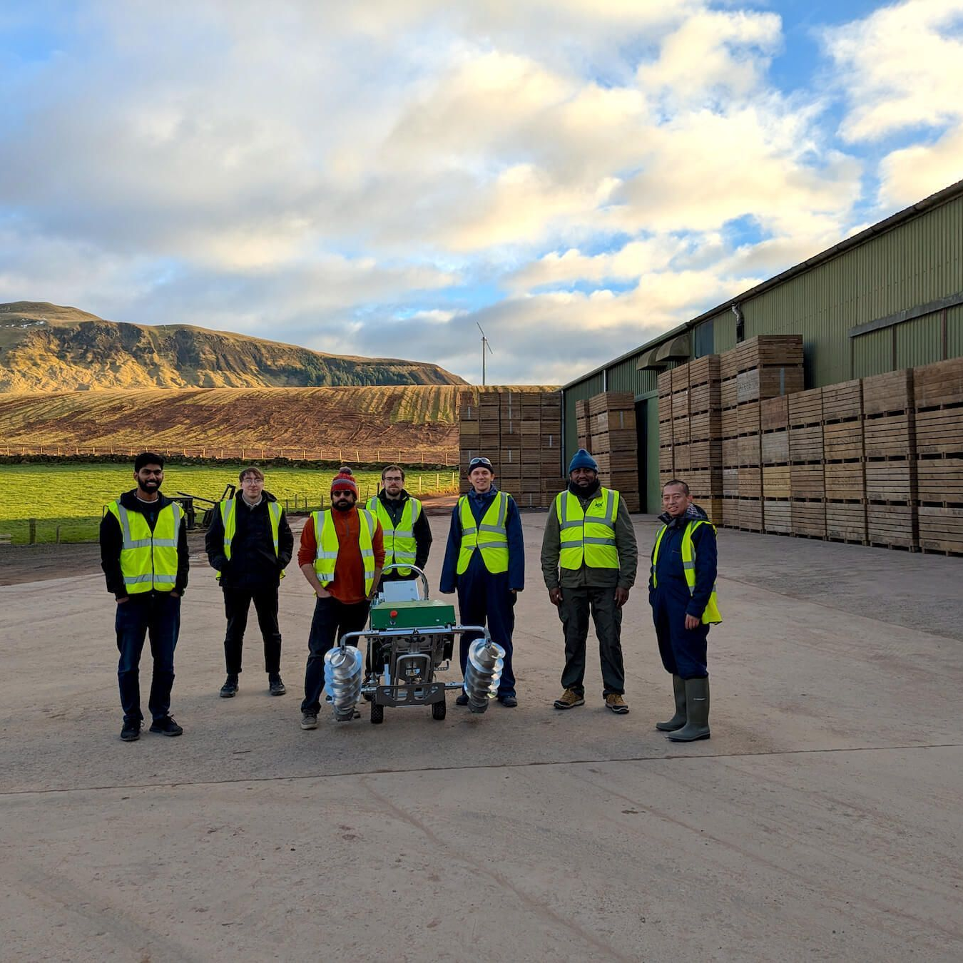 Crover team with system outside grain storage shed