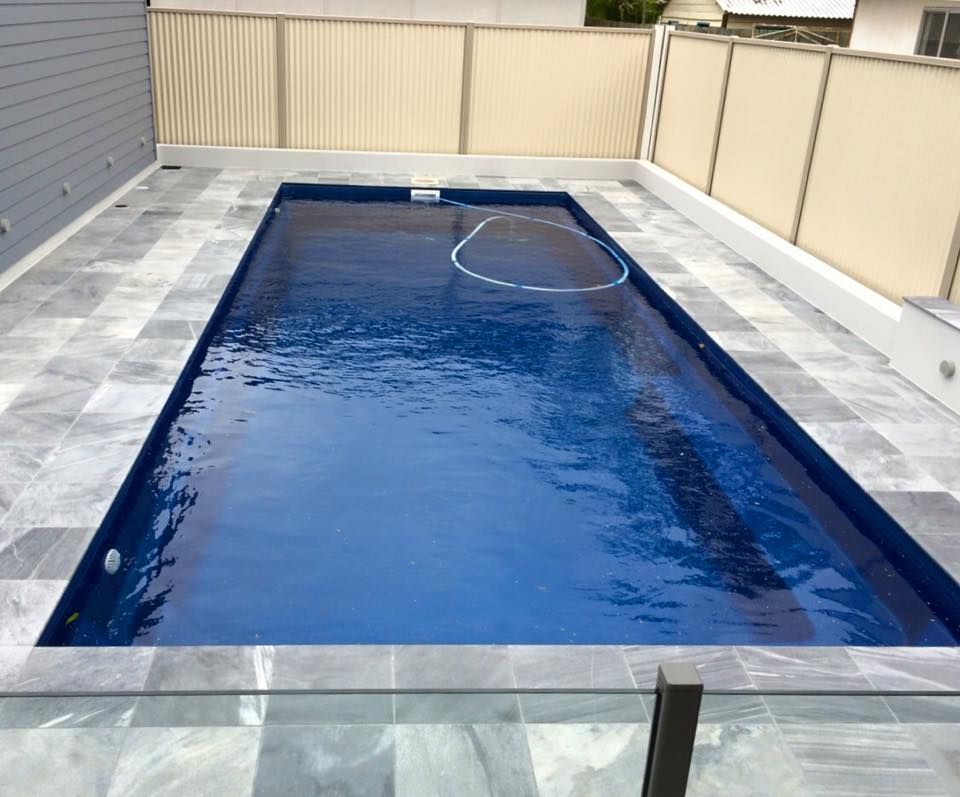 A Blue Pool Undergoing A Maintenance