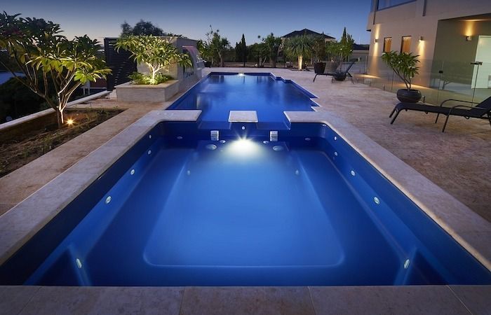 A Swimming Pool With a Step in the Middle of It — Aqualine Pools in Coral Cove, QLD