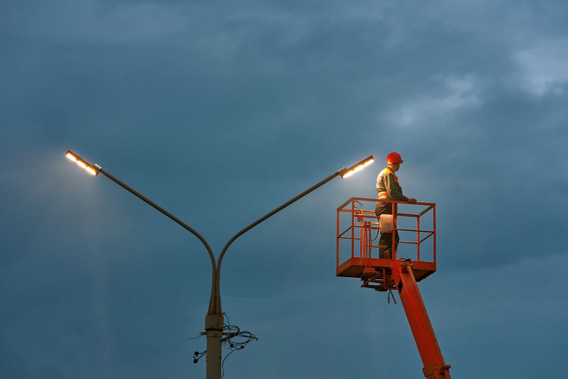 Hand Of An Electrician With Multimeter Probe — Mingleford Electrical Airconditioning Solar & Gas In Landsborough, QLD