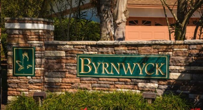 A sign on a stone wall that says byrn wyck