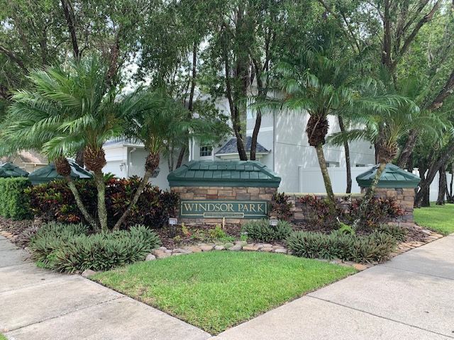 A sign for windsor park is in front of a house