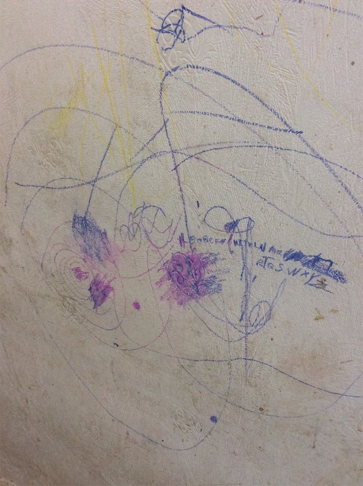 Graffiti markings on living room wall surface – check-out inspection