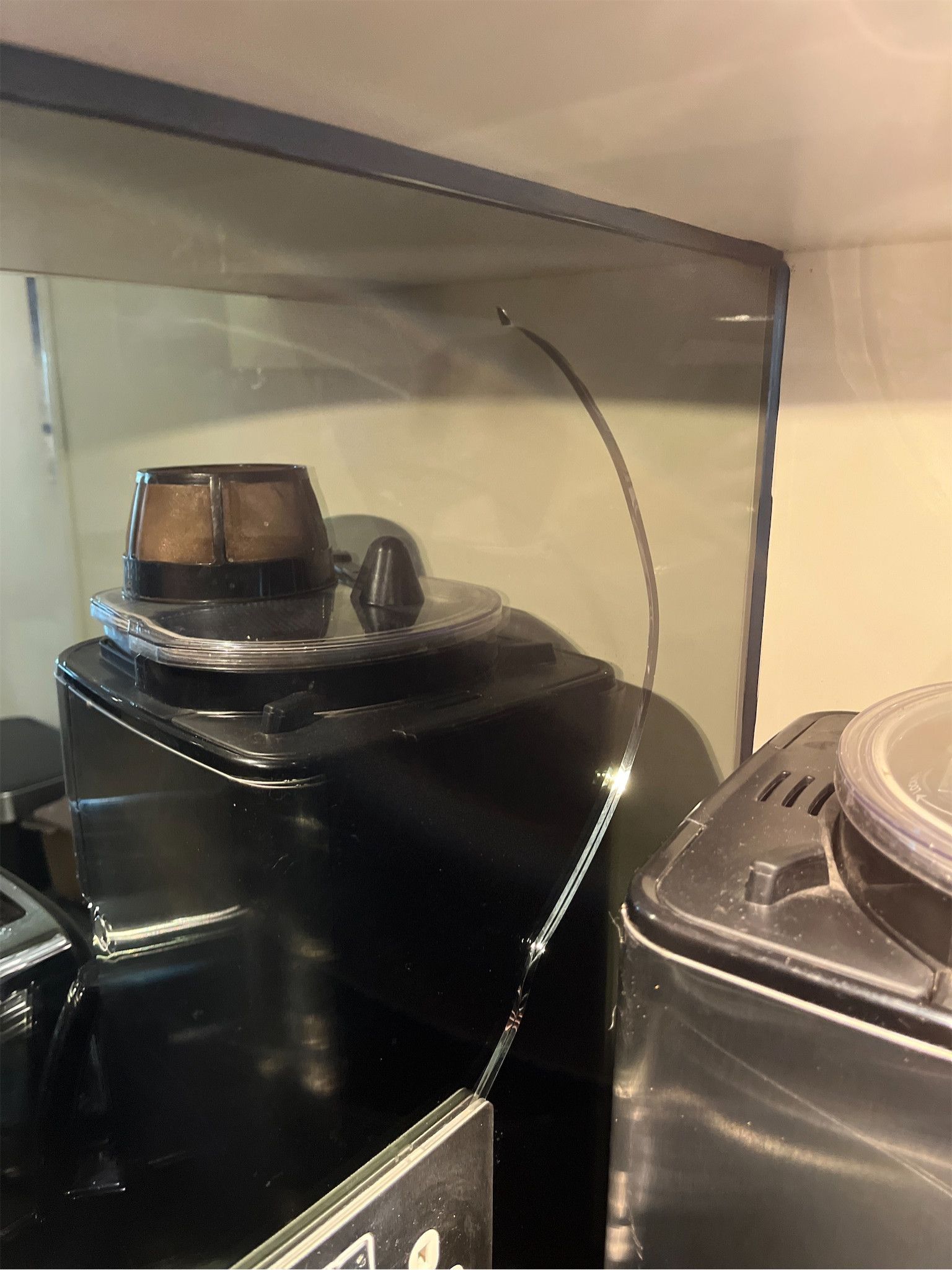 Large crack to mirrored kitchen work surface – damage documented