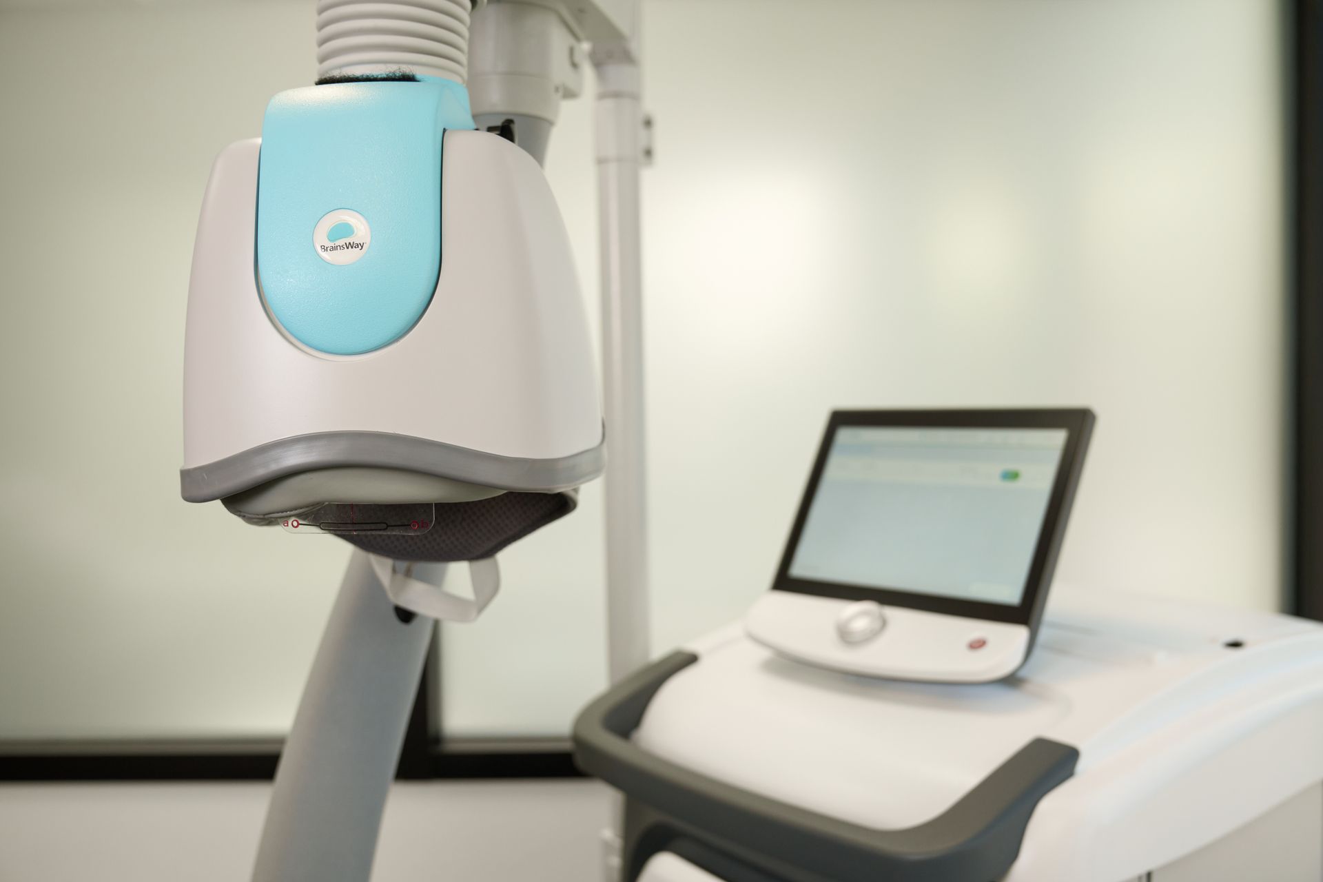 A medical device is sitting on a table in a room.
