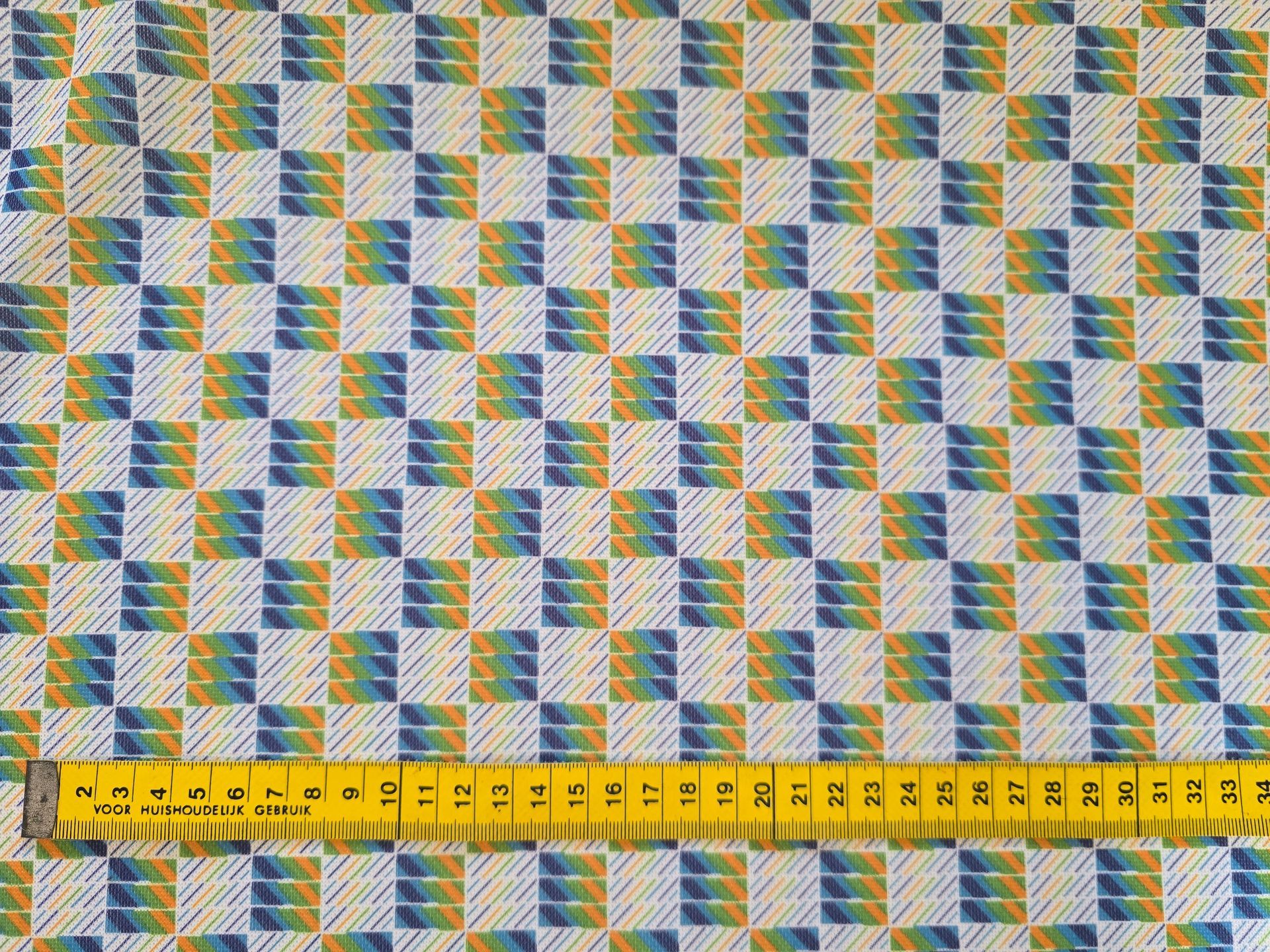 Trevira 2000 blauw met groen en gele vierkantjes