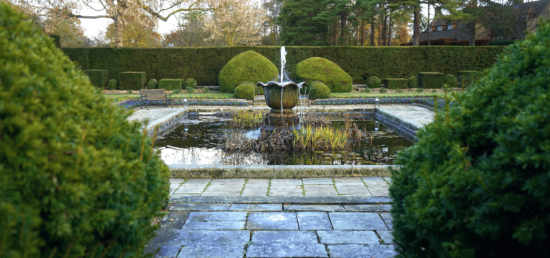 A fountain in the center of a fire-resistant landscape