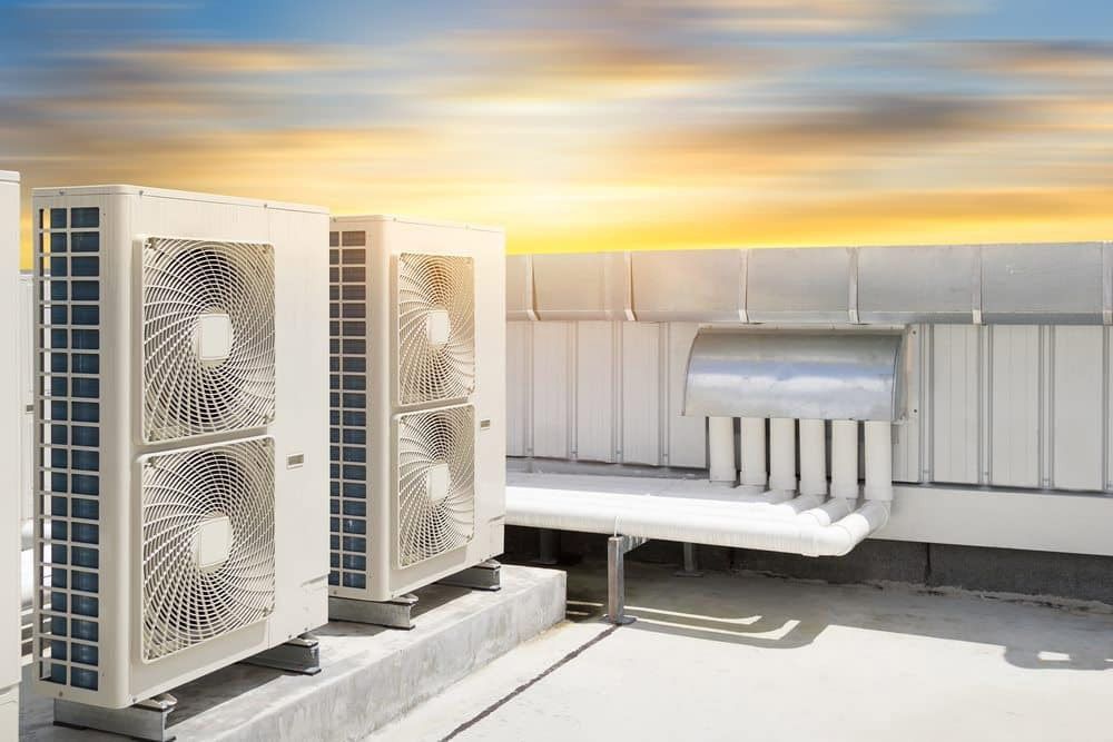 There Are Two Air Conditioners On The Roof Of A Building — Jordan Wheatland Air Conditioning & Refrigeration In Dubbo, NSW