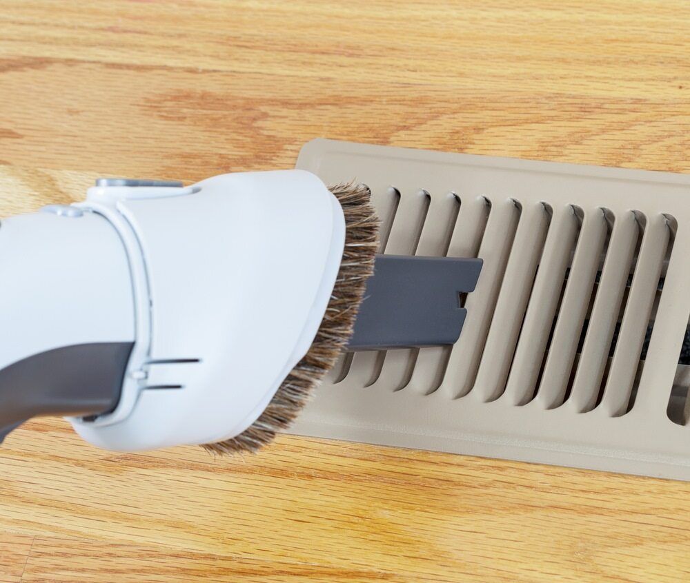 A Vacuum Cleaner With A Brush Attached To It — Jordan Wheatland Air Conditioning & Refrigeration In Dubbo, NSW