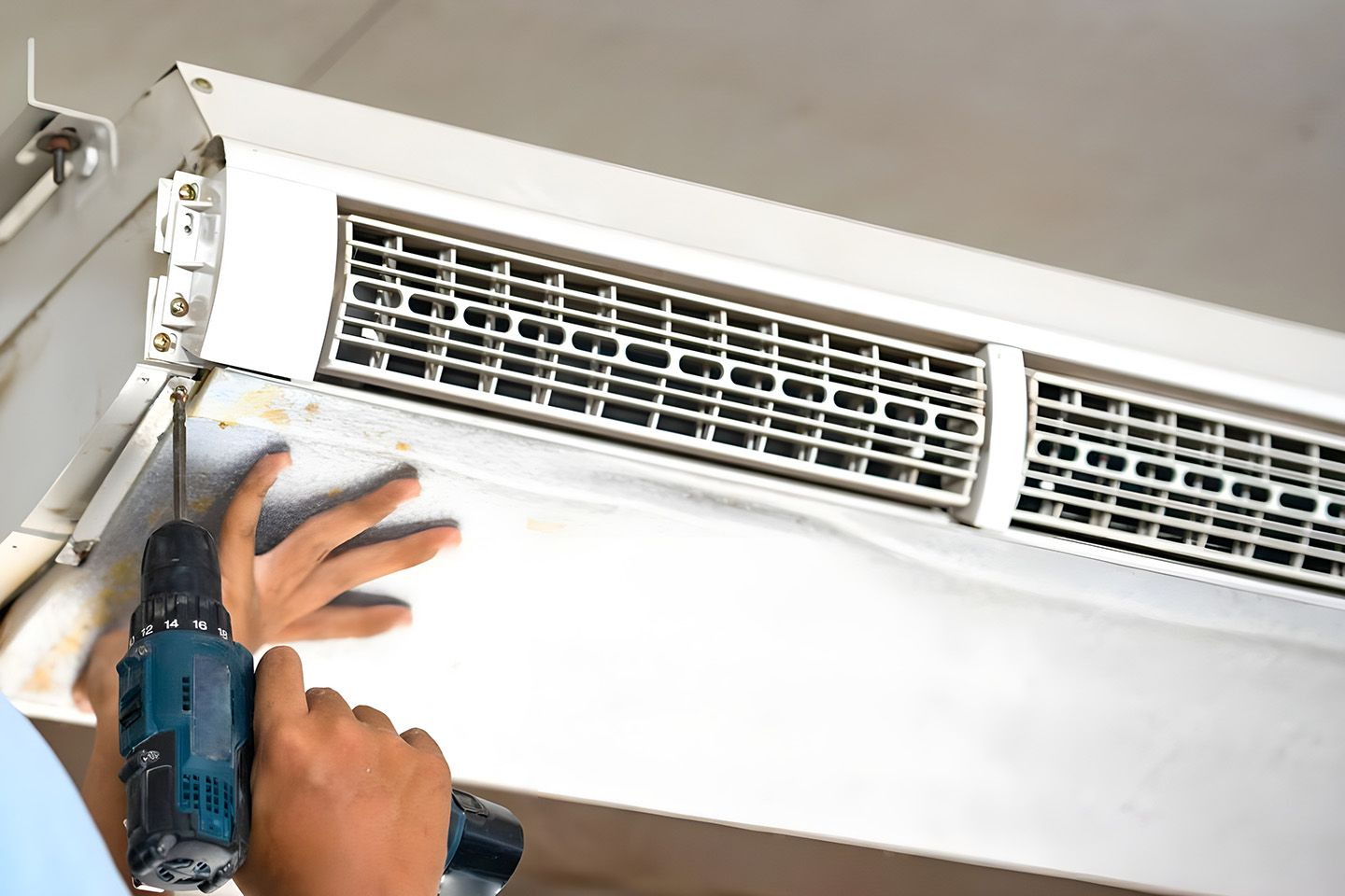 Hand Using A Drill On Air Conditioner 