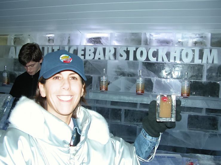 Beth from It's Just Stuff holding a drink in an ice bar