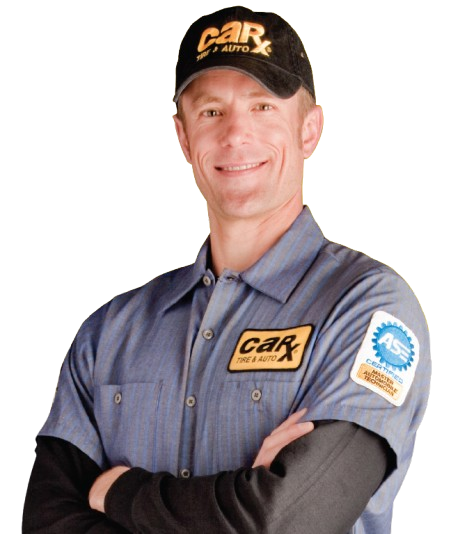 Smiling worker in blue uniform and black cap with logo, standing with arms crossed on white background