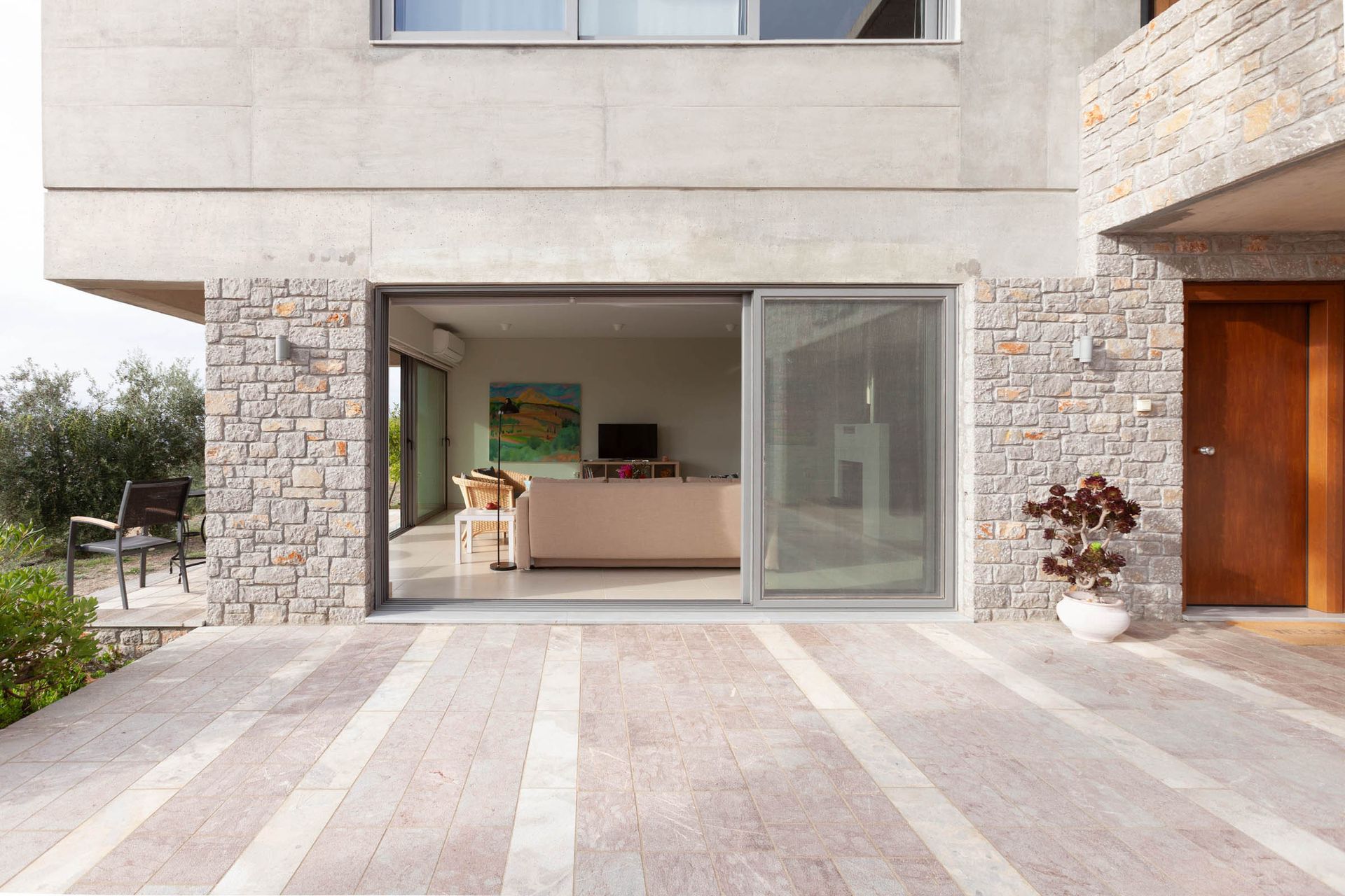 Stone villa exterior with an open terrace entrance