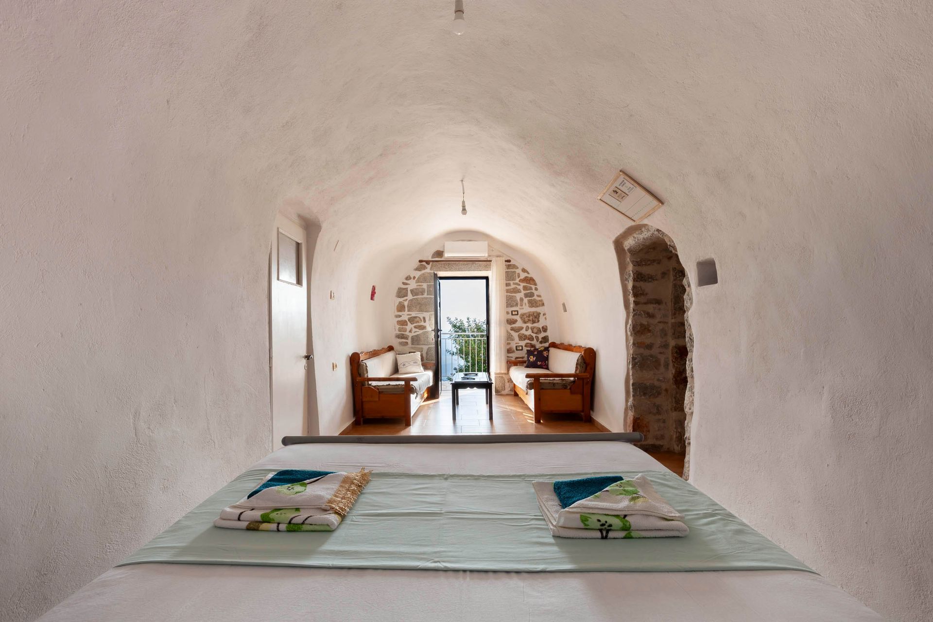 White vaulted interior in a traditional stone property