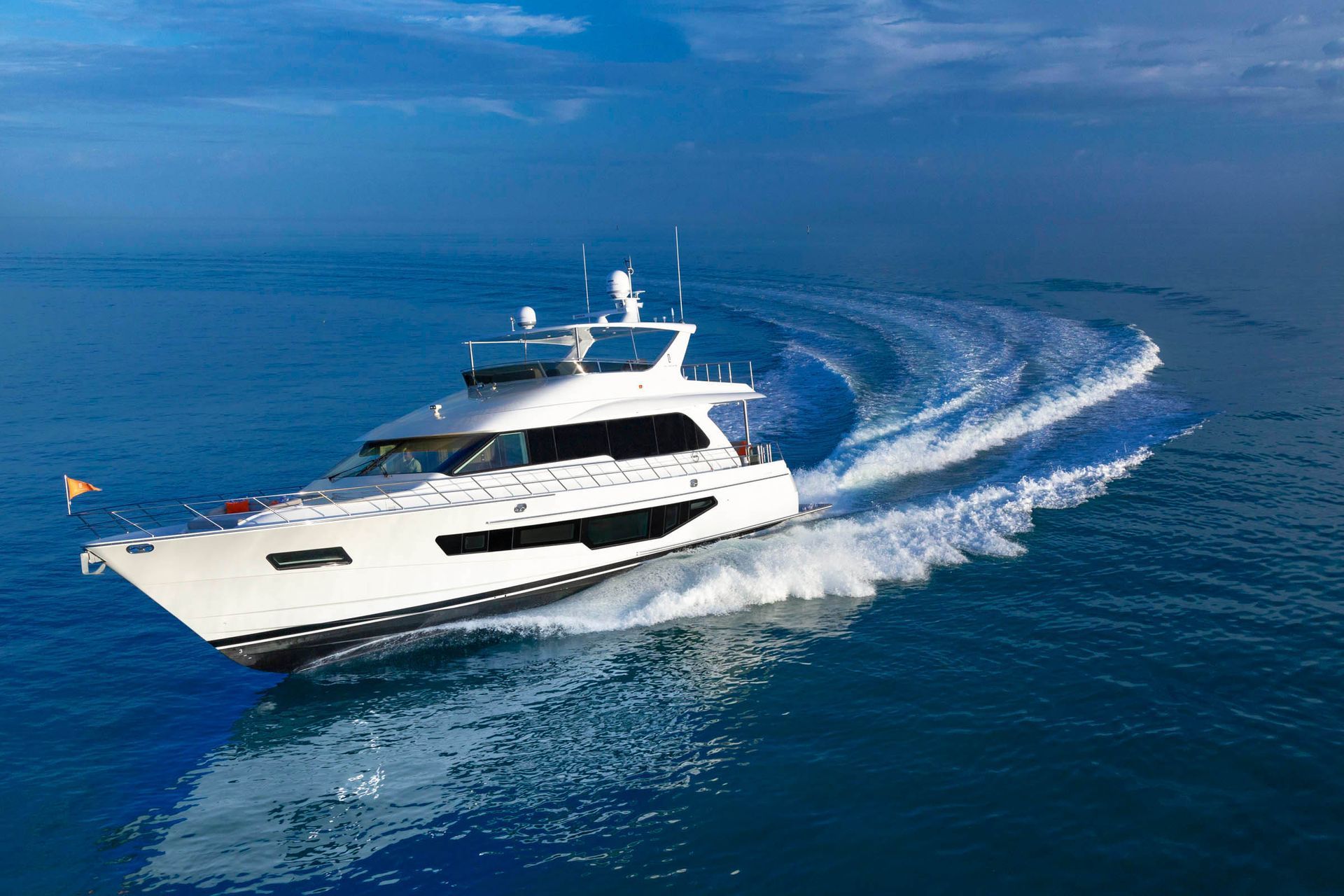Aerial view of a CLB motor yacht cruising at sea