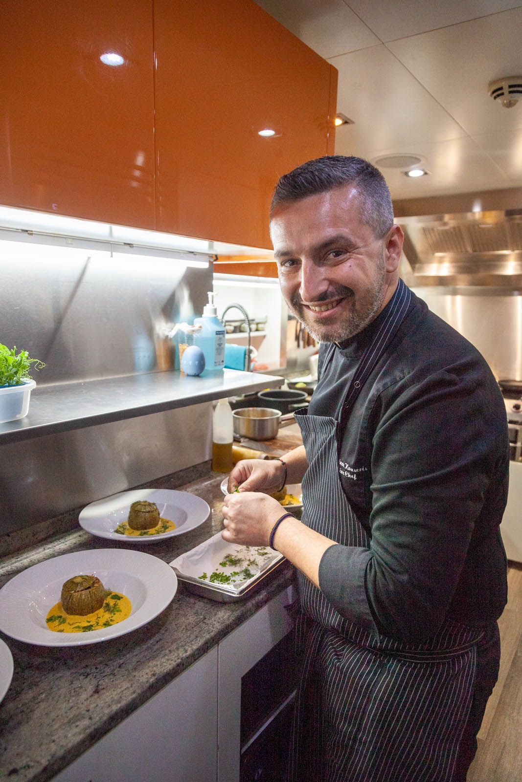 Chef preparing a dish aboard motor yacht Africa