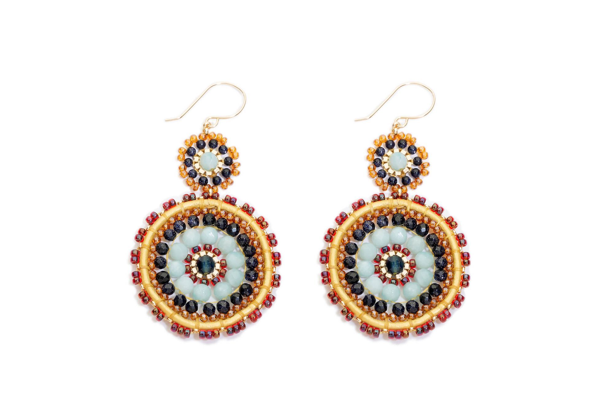 Colourful beaded earrings photographed on white