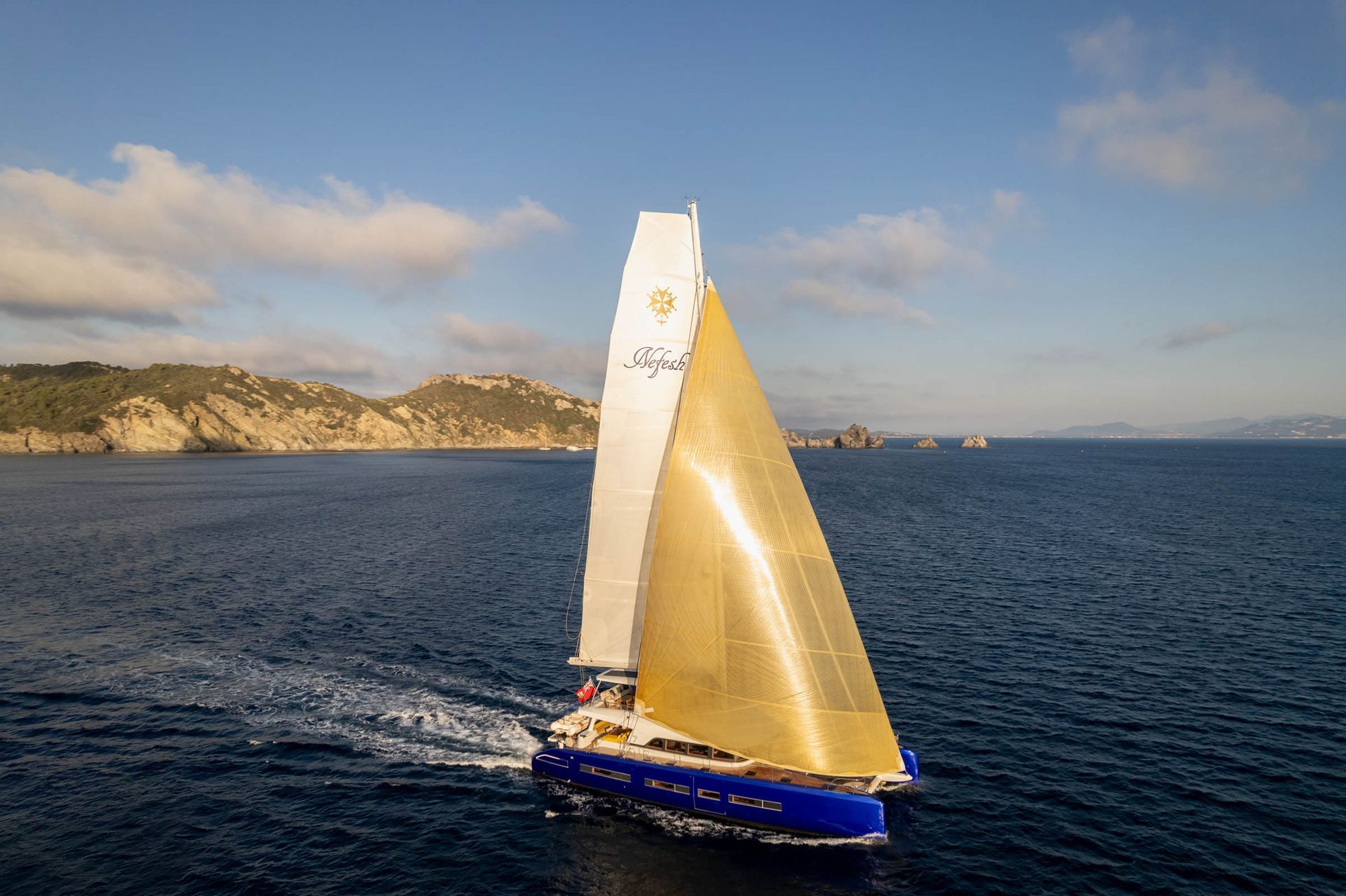 Catamaran under sail photographed from the air