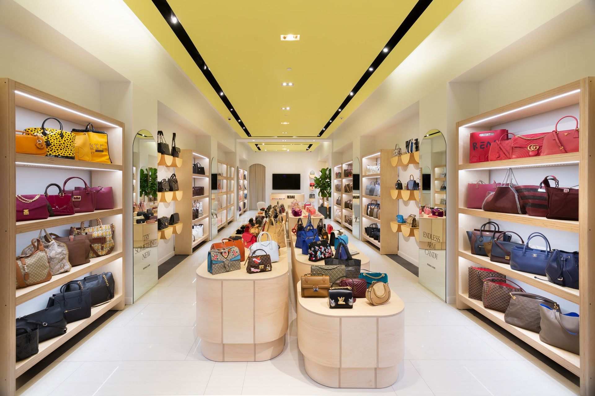 Luxury handbag displays inside the Rebag Dadeland store