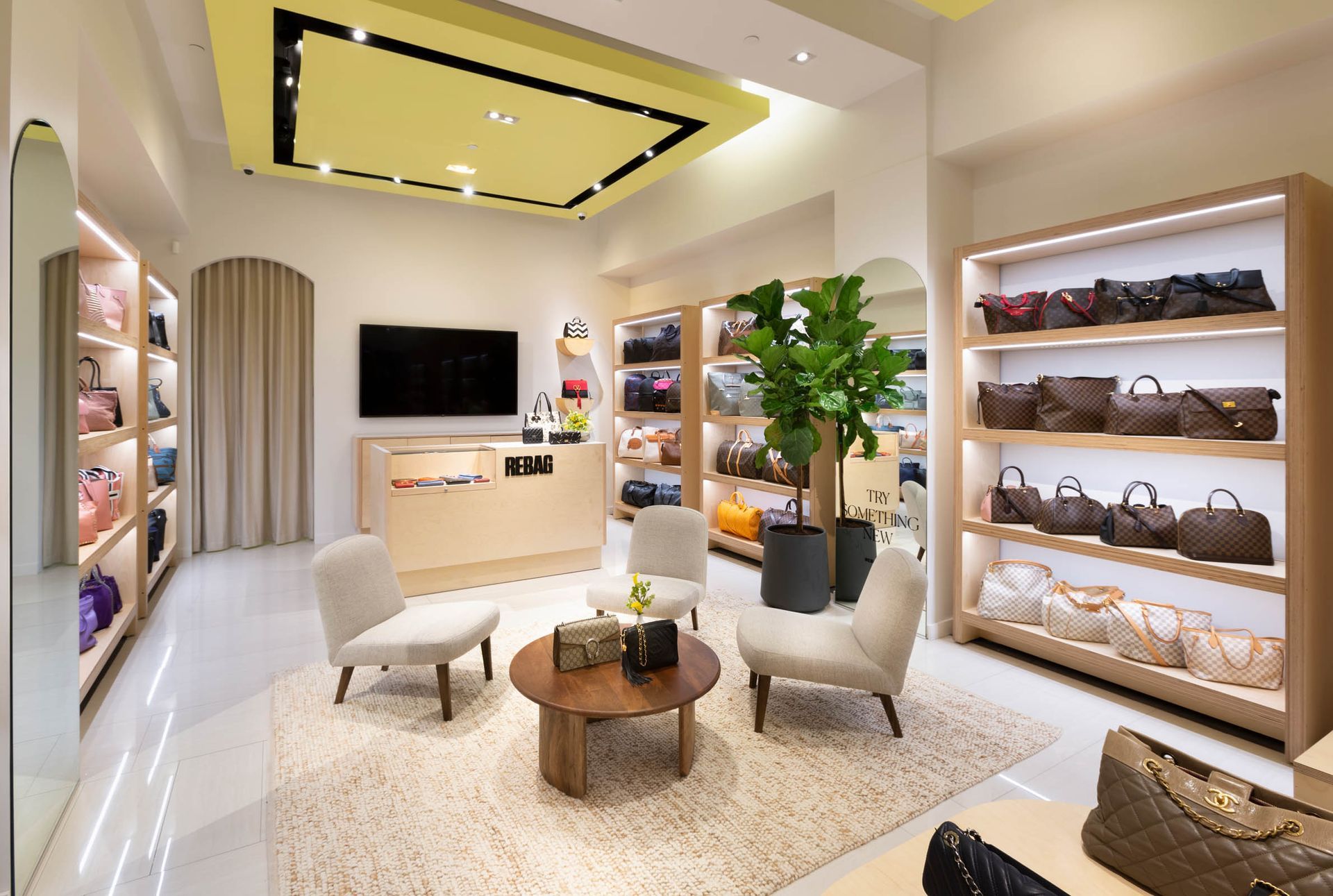 Interior of the Rebag Dadeland luxury handbag store