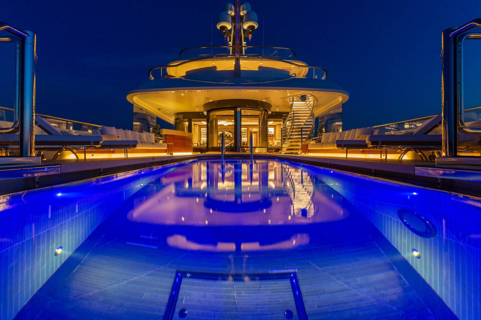 Illuminated yacht deck and pool at night