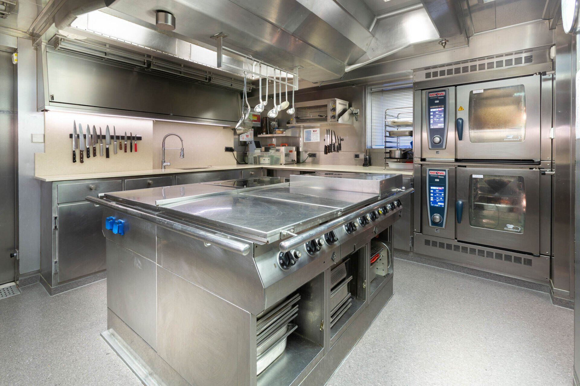 Galley with centre island aboard motor yacht Kogo