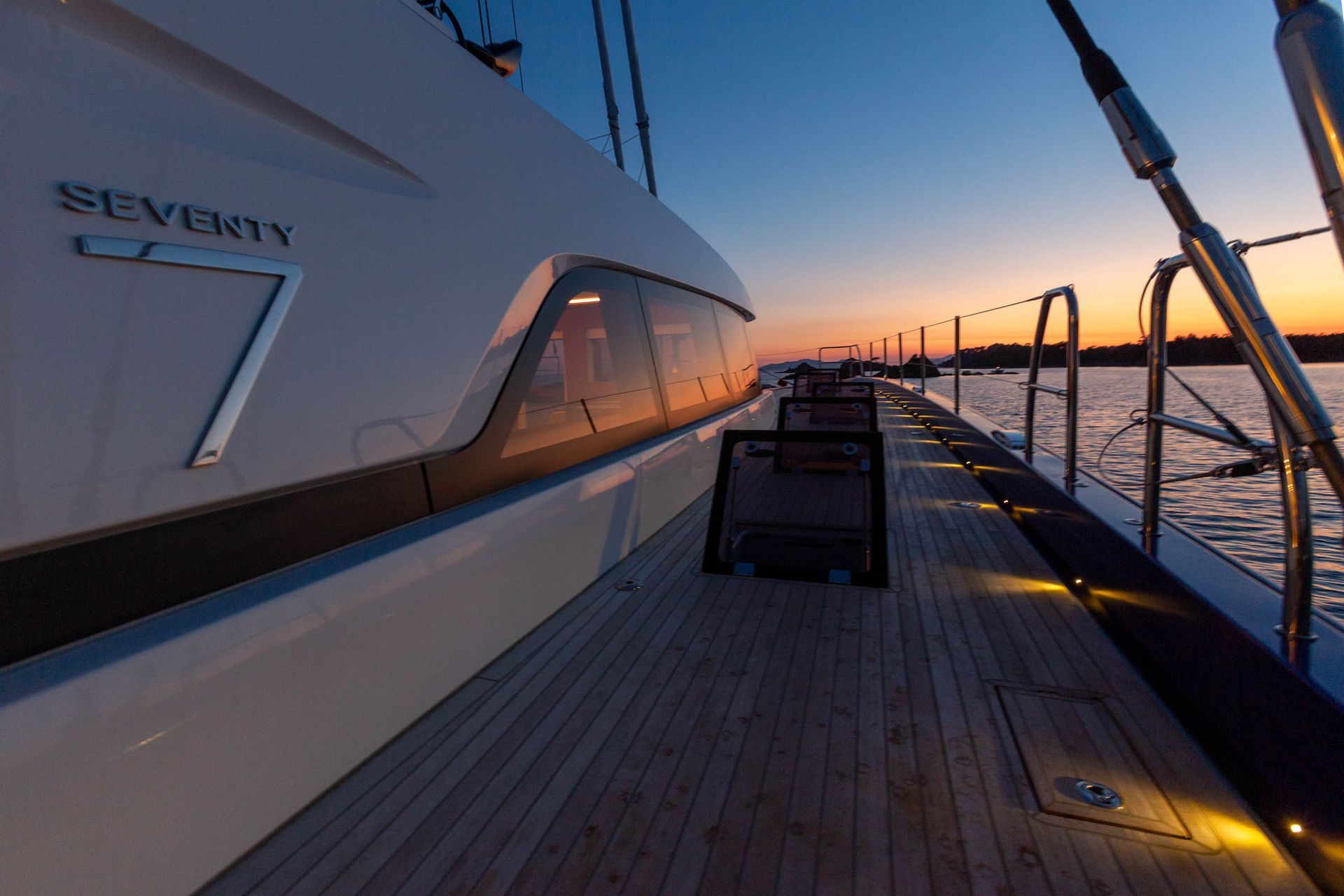 Teak catamaran deck and rigging at dusk
