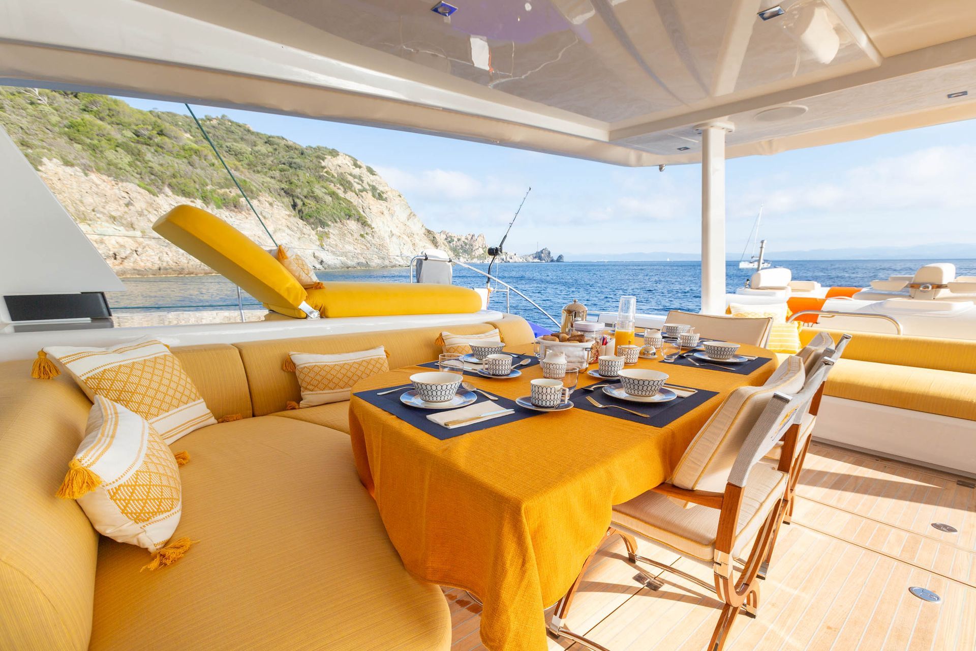 Prepared exterior dining and lounge space overlooking the sea
