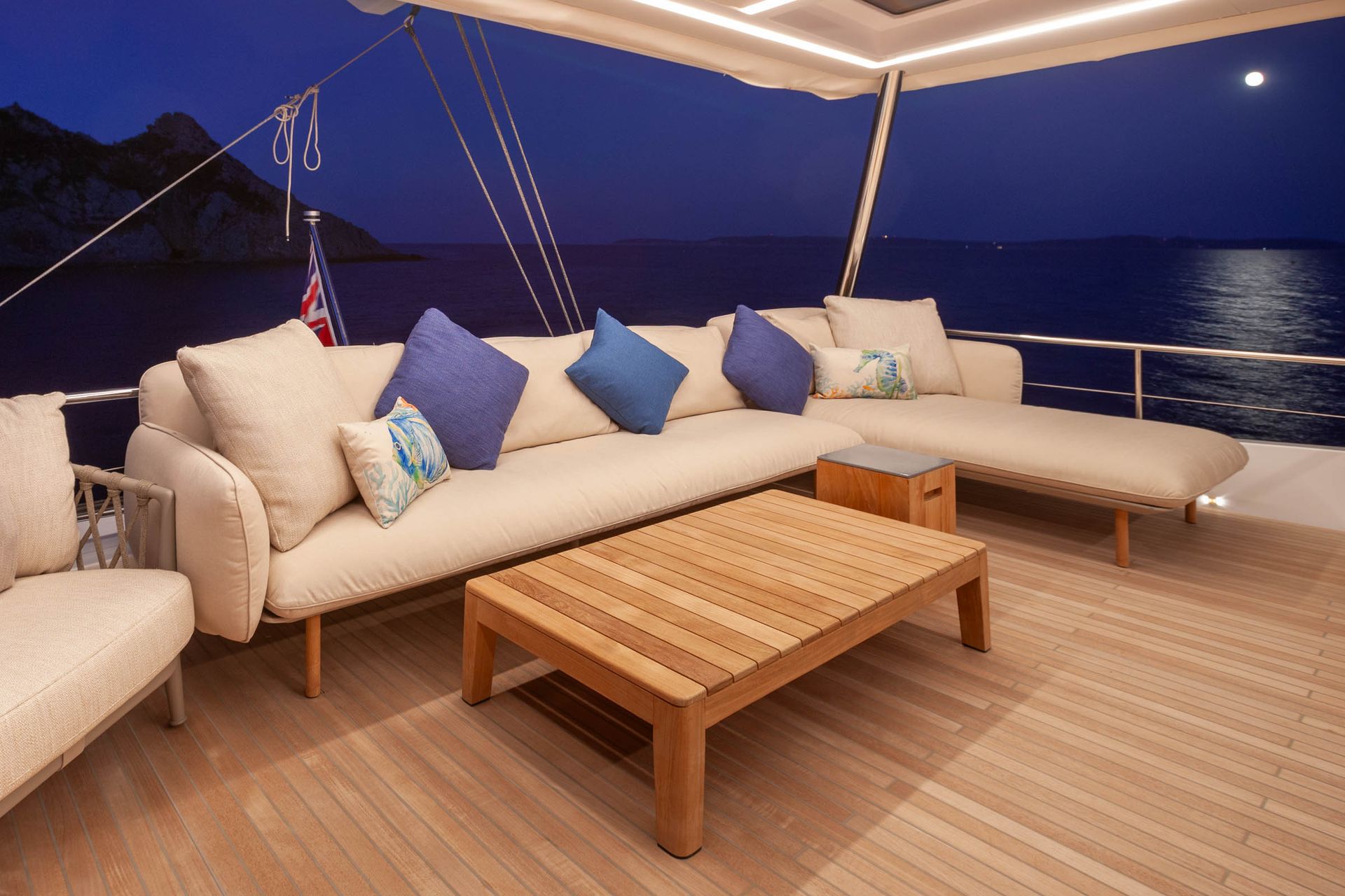 Illuminated exterior lounge and dark Mediterranean sea at night