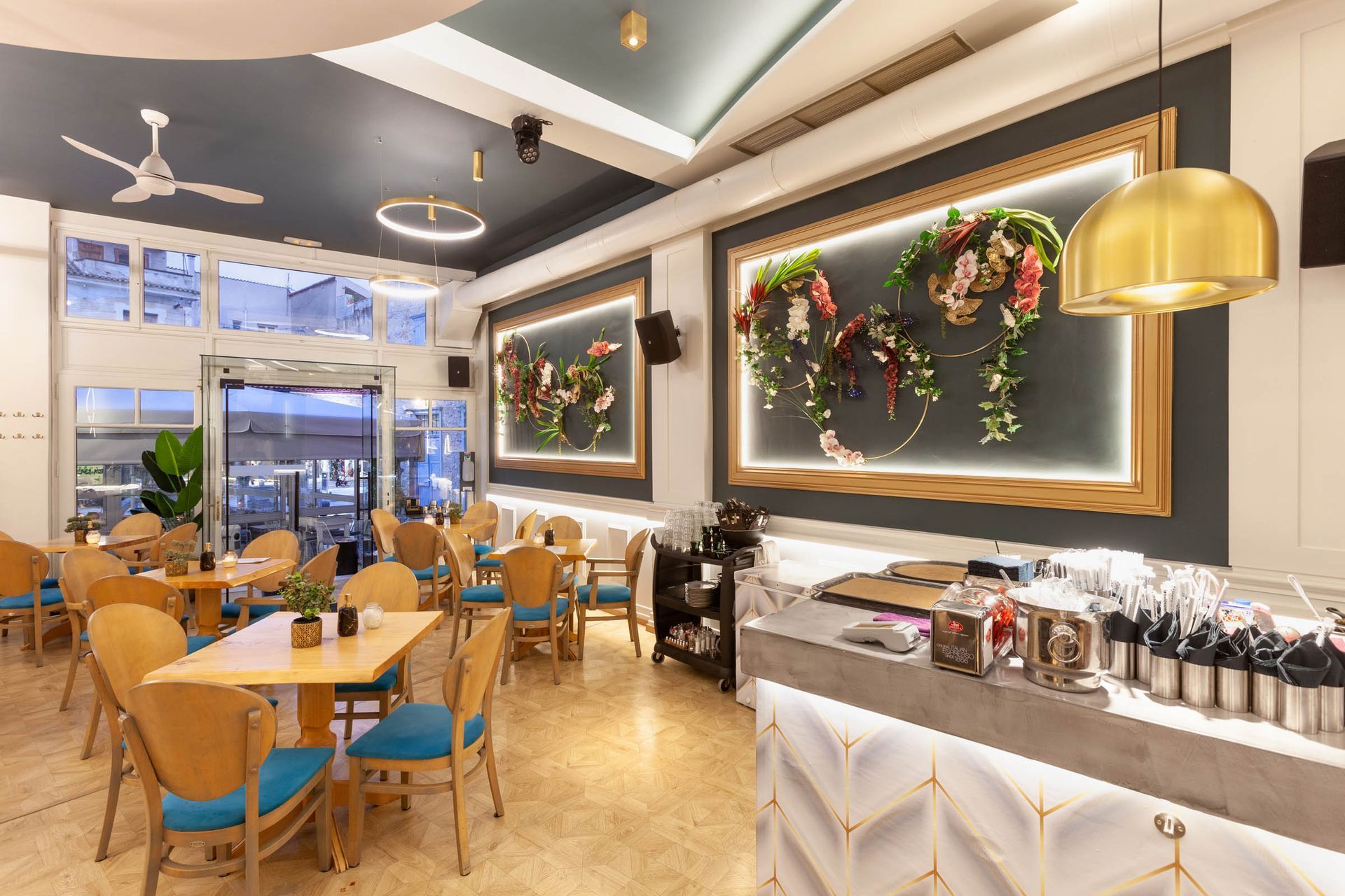 Modern restaurant dining room with botanical wall art
