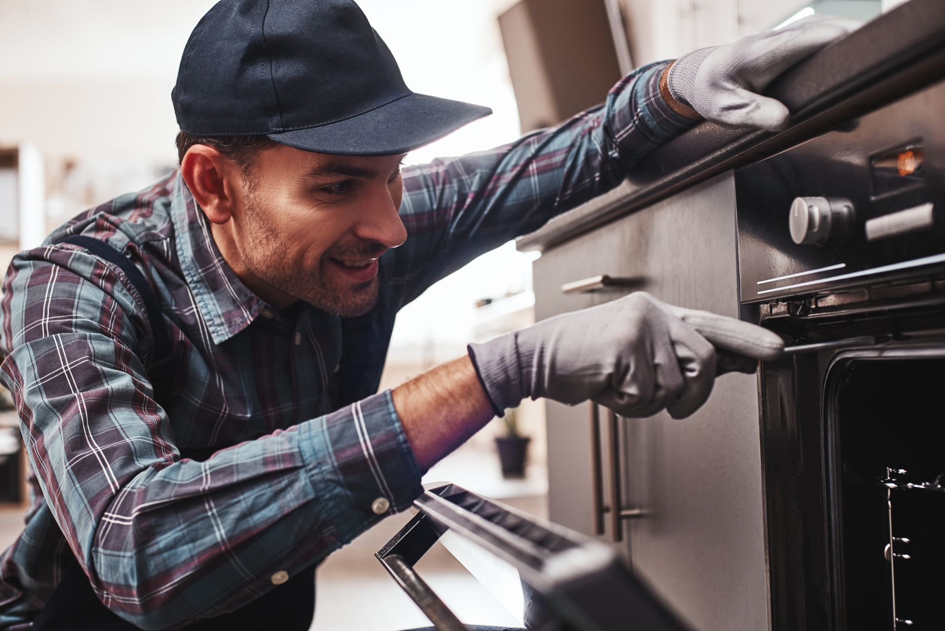 Certified appliance repair expert servicing a dishwasher in Benton LA kitchen