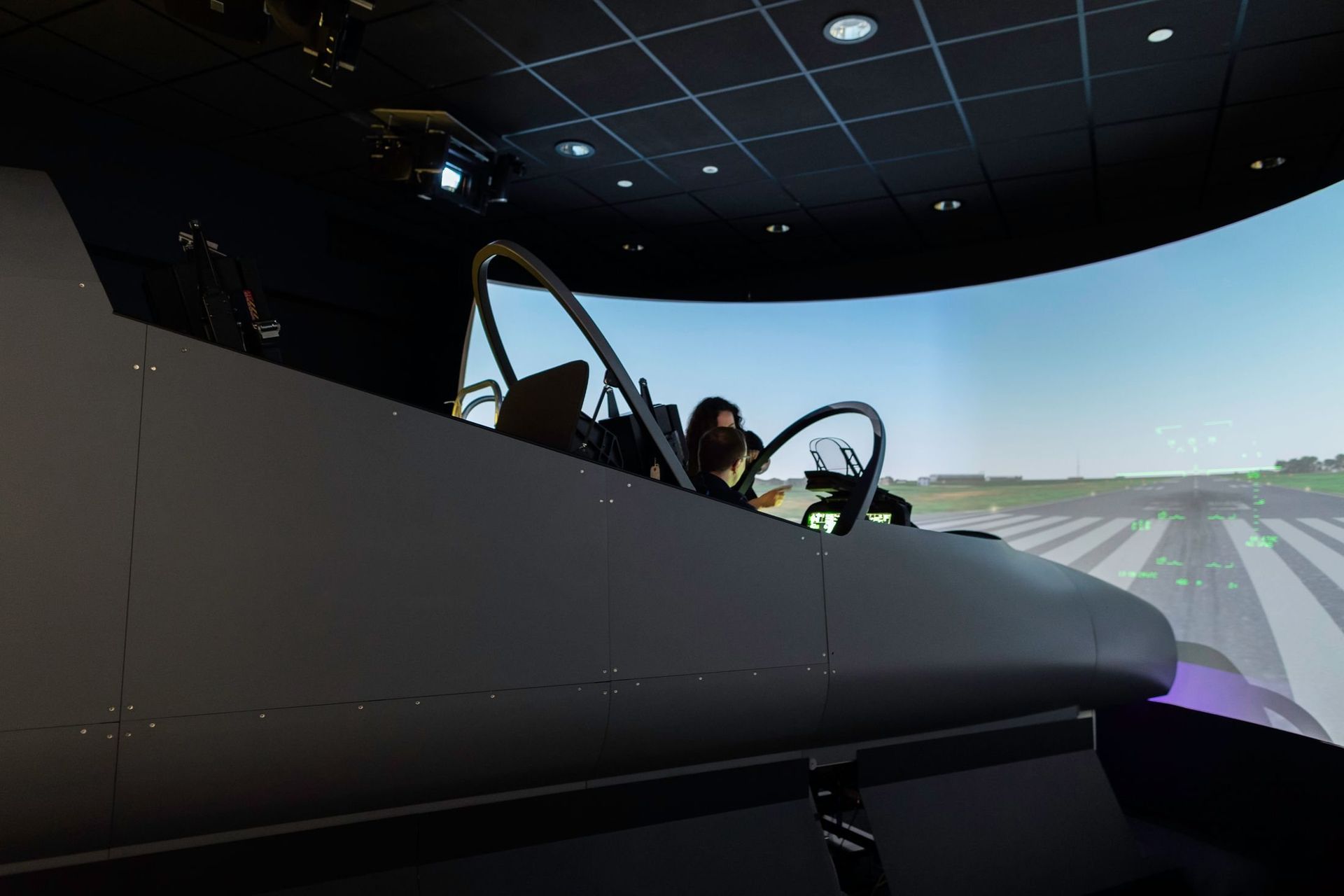 Engineer operating an advanced flight simulator