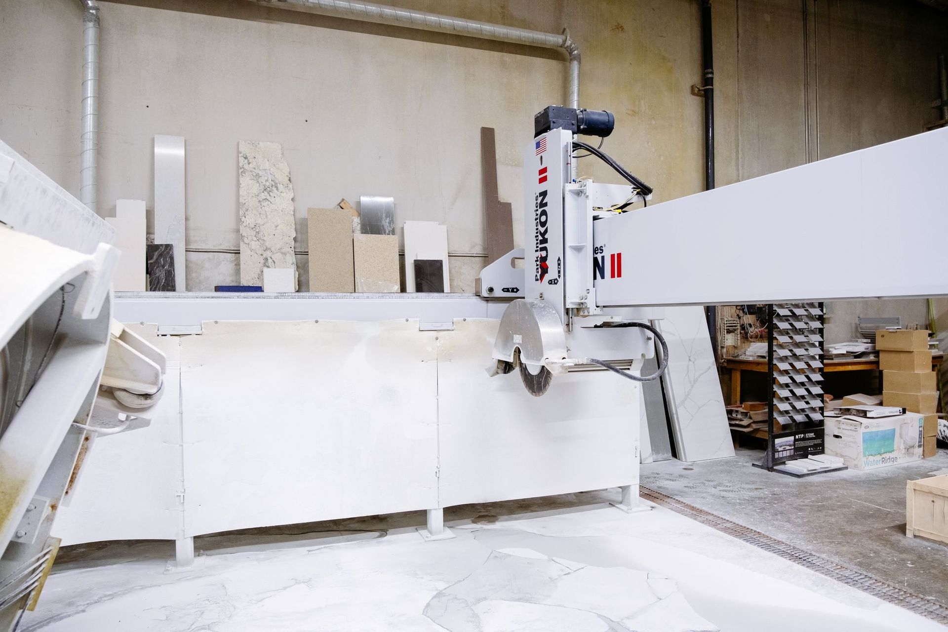 Industrial equipment cutting and fabricating granite slabs