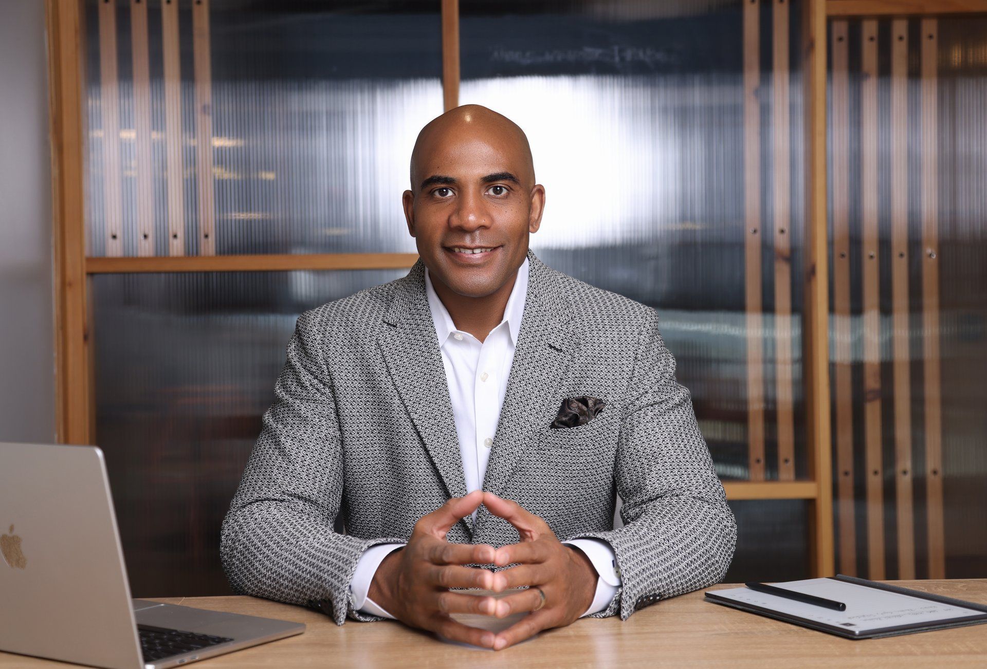Torey Hinkson, President and Owner of First Choice Business Brokers Peachtree, seated at his desk